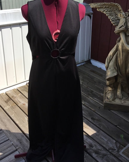 Black 1 pc romper jumpsuit. Low cut open sides