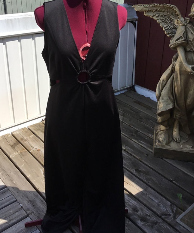 Black 1 pc romper jumpsuit. Low cut open sides