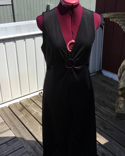 Black 1 pc romper jumpsuit. Low cut open sides