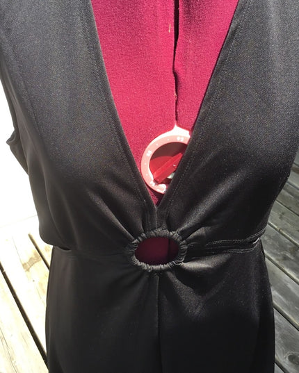 Black 1 pc romper jumpsuit. Low cut open sides