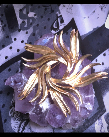 Vintage gold starburst swirl brooch 1960s