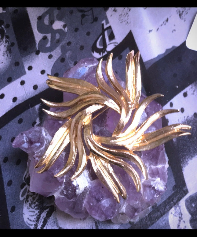 Vintage gold starburst swirl brooch 1960s