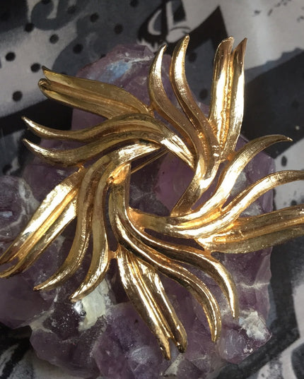 Vintage gold starburst swirl brooch 1960s
