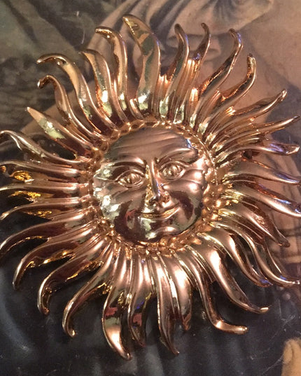 Gold tone heavy SUN brooch