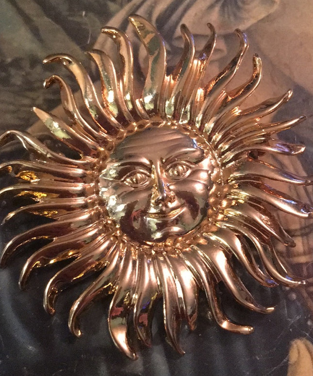 Gold tone heavy SUN brooch