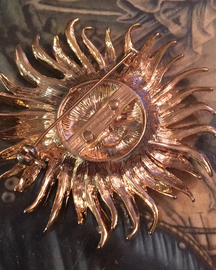Gold tone heavy SUN brooch