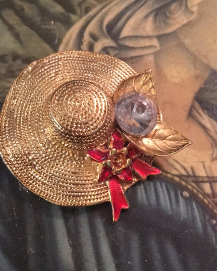 Gold tone hat crystal brooch