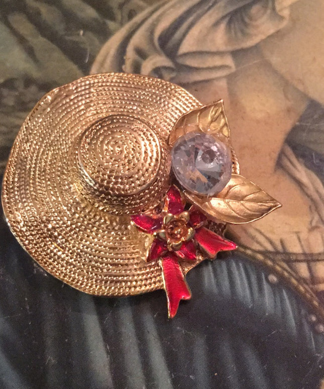 Gold tone hat crystal brooch
