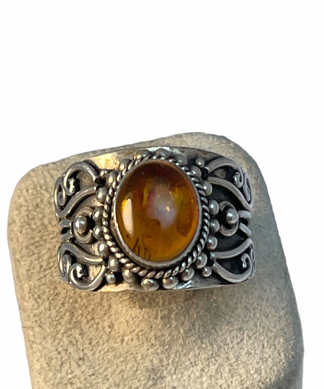 Sterling silver fancy cigar band amber ring