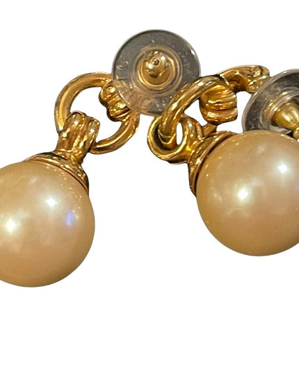 Chunky 1980s large faux pearl ball with gold finish dangle pierced earrings