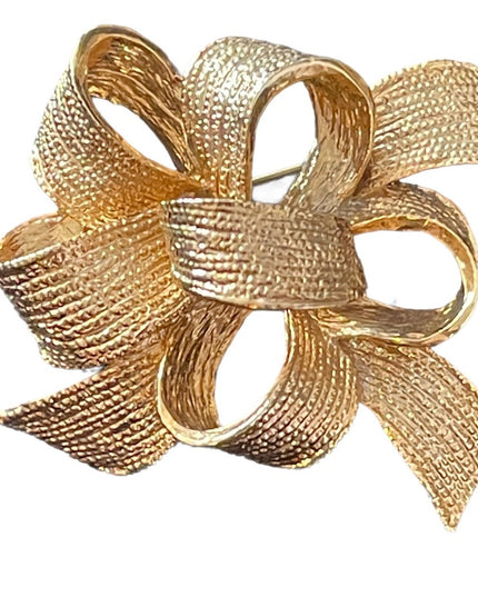 Brushed gold fancy ribbon brooch