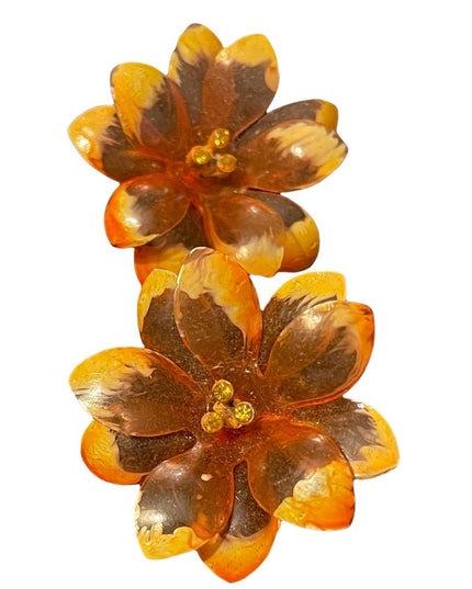 Vintage large orange plastic fancy flower clip on earrings