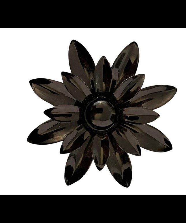 Vintage 1960s black flower metal groovy brooch