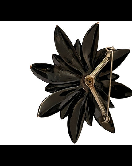 Vintage 1960s black flower metal groovy brooch