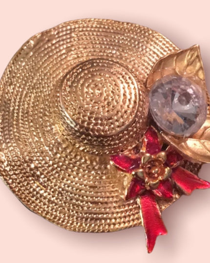 Gold tone hat crystal brooch