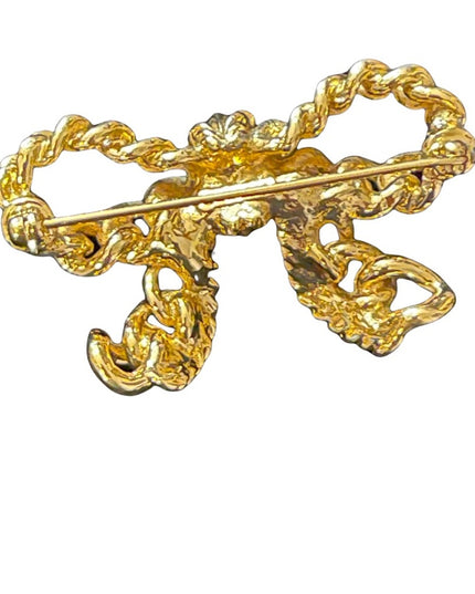 Vintage gold Nina Ricci bow brooch