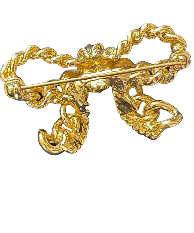 Vintage gold Nina Ricci bow brooch