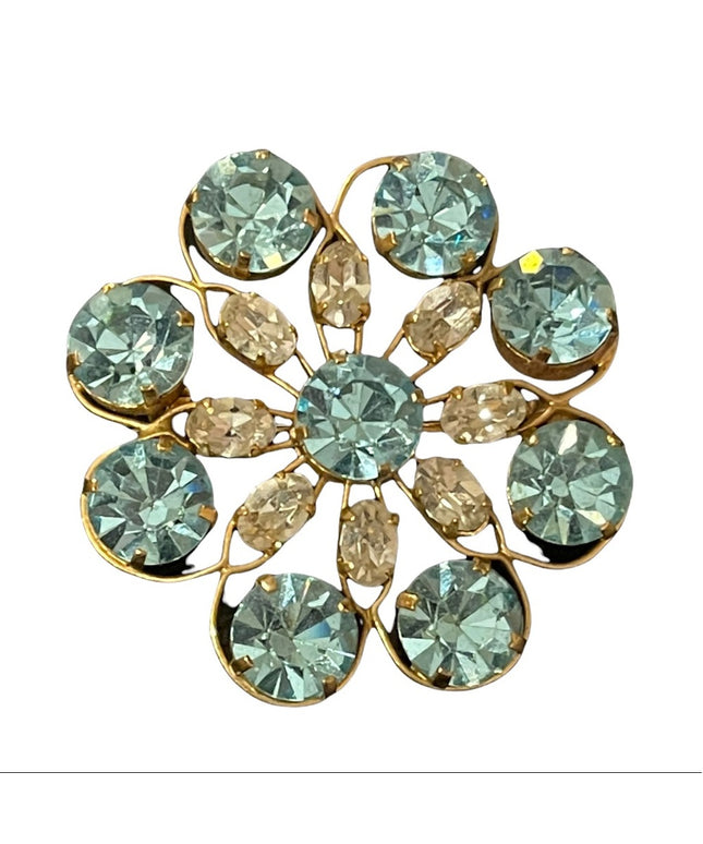 Vintage appx 1950s blue & clear crystal gold finish flower brooch