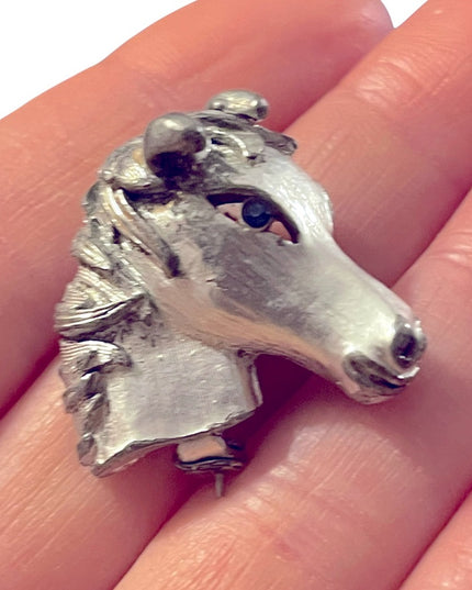 Vintage antiqued silver finish blue crystal eye horse brooch