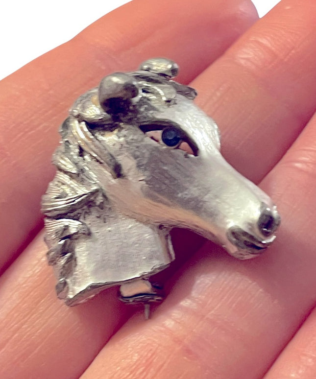 Vintage antiqued silver finish blue crystal eye horse brooch