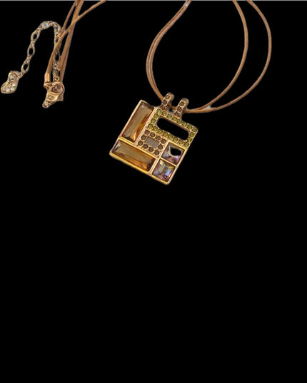 Swarovski Authentic (swan) Square crystal rose gold plt leather cord necklace
