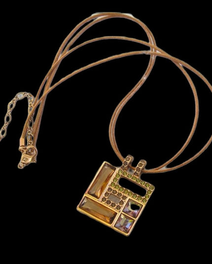 Swarovski Authentic (swan) Square crystal rose gold plt leather cord necklace