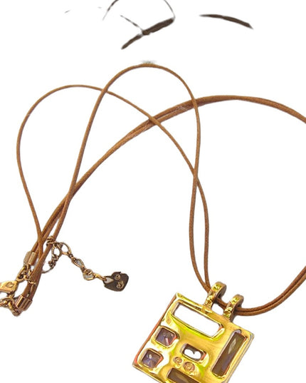 Swarovski Authentic (swan) Square crystal rose gold plt leather cord necklace