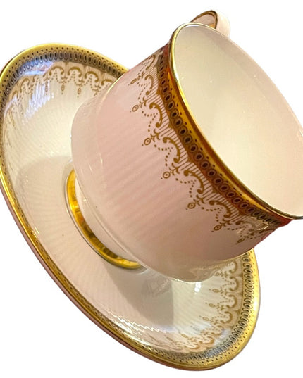 Vintage Paragon Athena tea cup and saucer gold magestic England fine chine