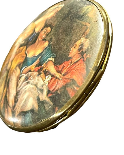Vintage Victorian scene gold finish metal mirrored compact