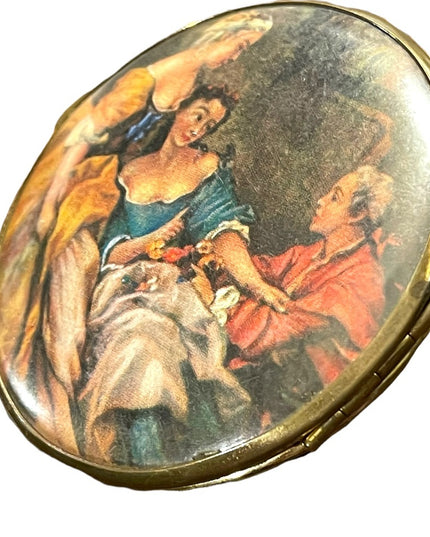 Vintage Victorian scene gold finish metal mirrored compact
