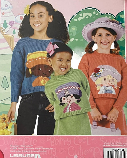 2 Books Knitting Crochet Care bears Afghans Strawberry Shortcake Sweaters