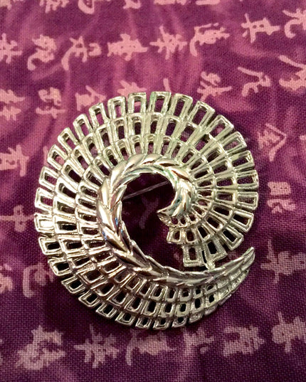 Vintage Sarah Coventry silver finish swirl brooch