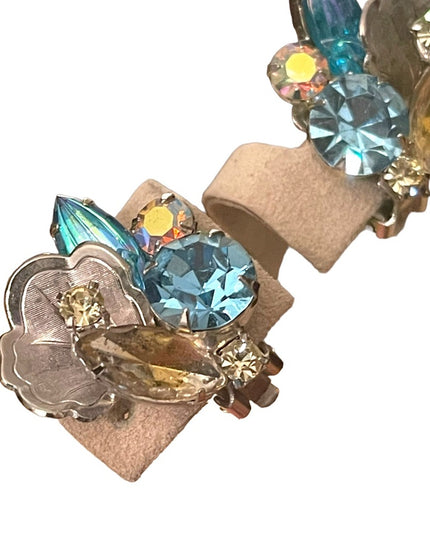 Stunning cintage fancy flower leaf blue crystal silver finish clipmon earrings