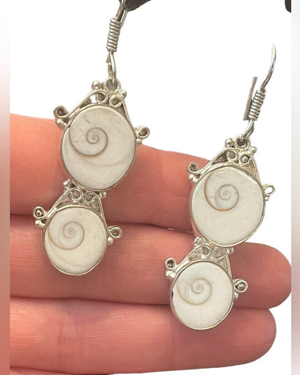 Fancy silver finish Indonesian shiva eye shell dangle earrings