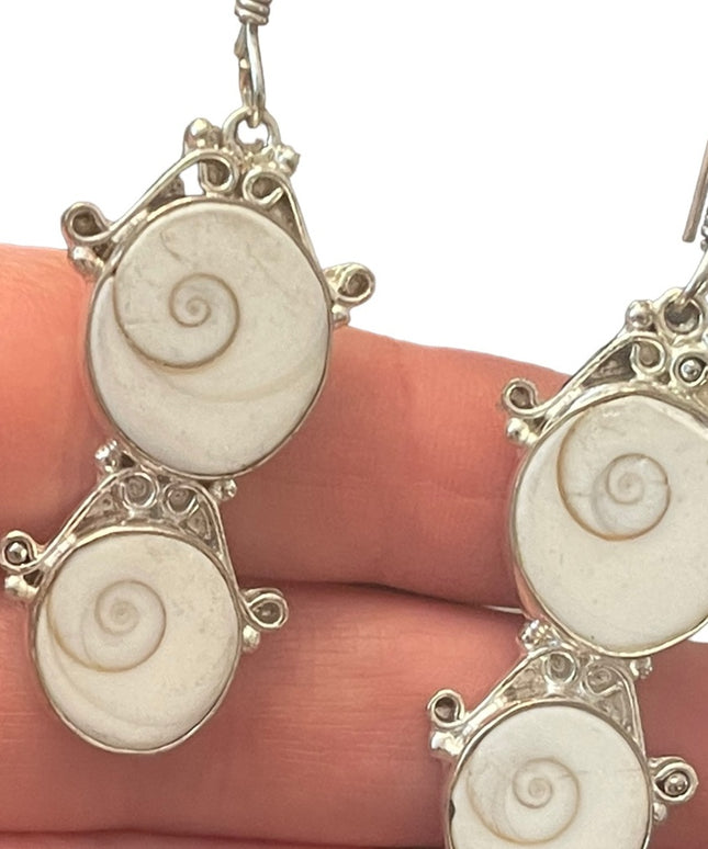Fancy silver finish Indonesian shiva eye shell dangle earrings