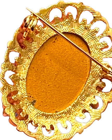 Fancy gold finish resin silhouette cameo brooch