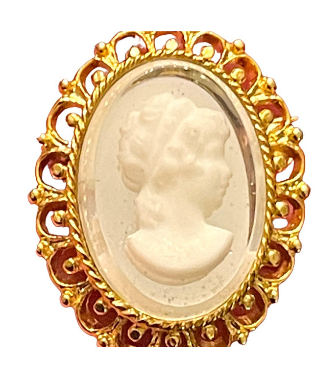 Fancy gold finish resin silhouette cameo brooch