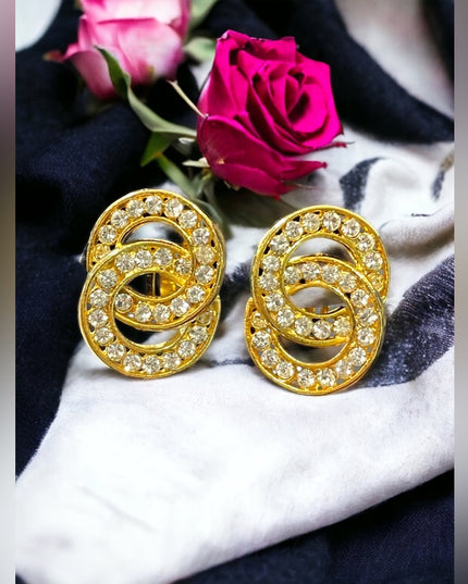 Lovely vintage 1980s NORMA JEAN gold finish rhinestone infinity circle clip ons