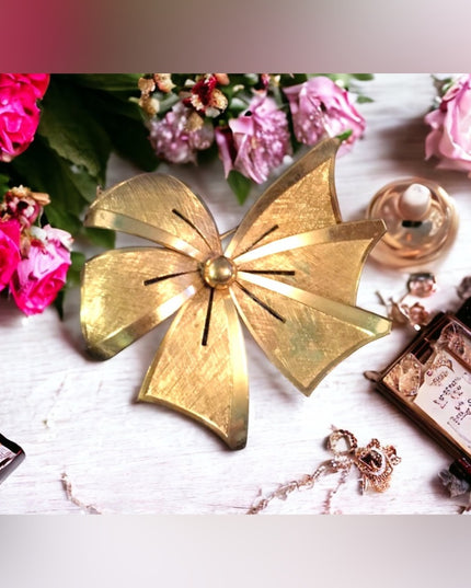 Vintage brushed gold tone brushed metal bow brooch