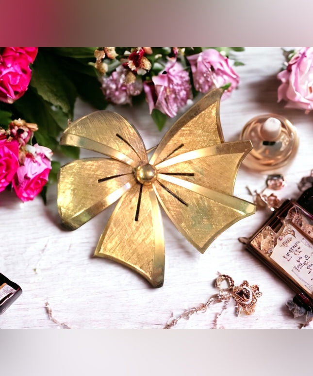 Vintage brushed gold tone brushed metal bow brooch