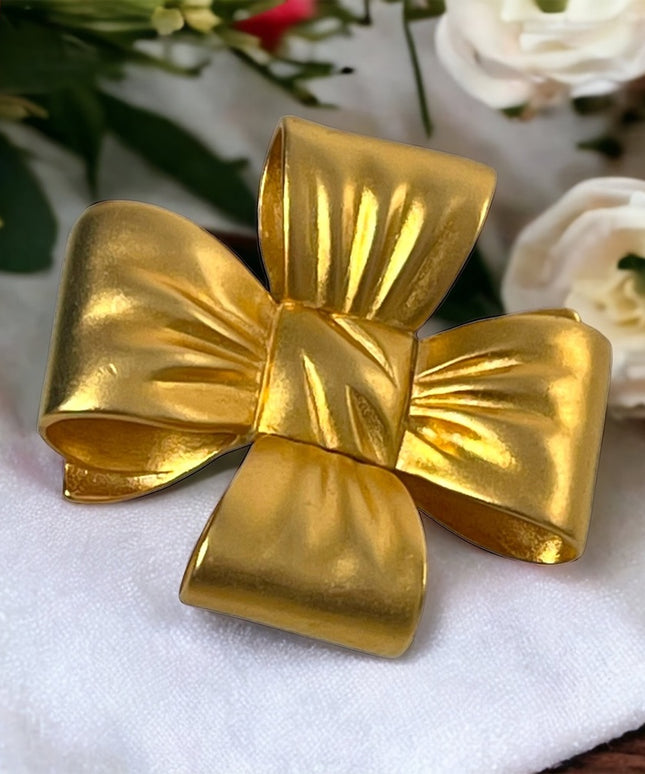 Large Heavy gold finish metal BOW brooch Etienne Aigner