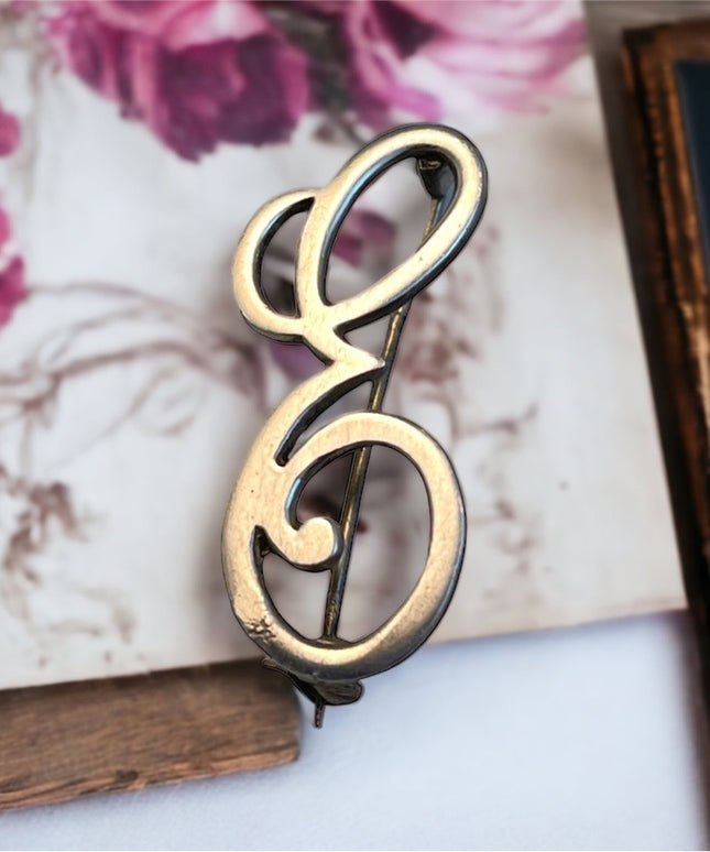 Vintage sterling silver E brooch
