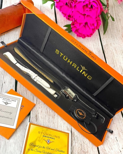 - NIB STUHRLING Origional womens watch with leather bands box papers
