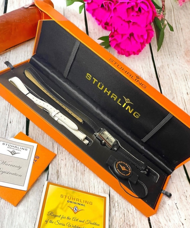- NIB STUHRLING Origional womens watch with leather bands box papers