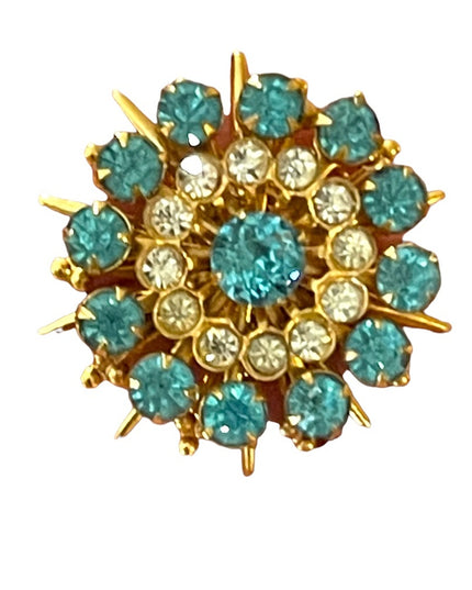 - Vintage blue clear crystal gold starburst brooch