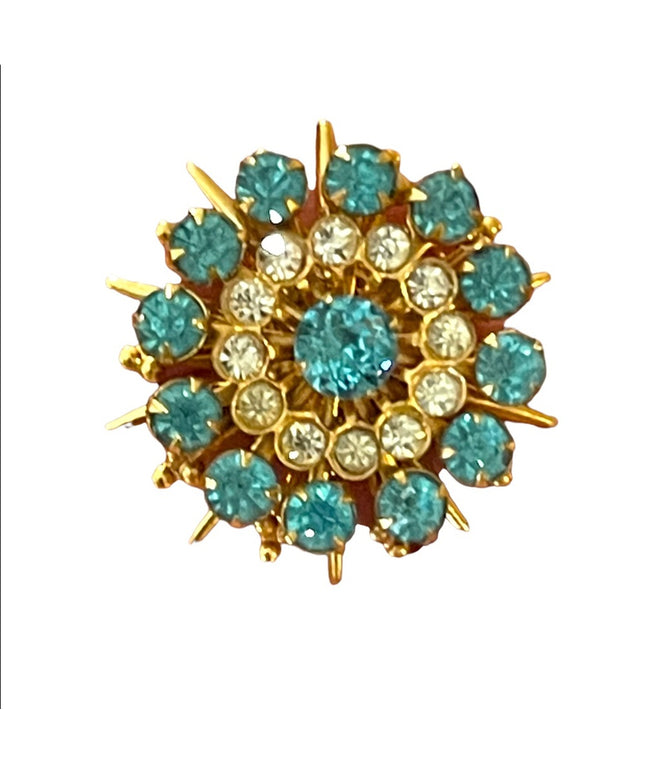 - Vintage blue clear crystal gold starburst brooch