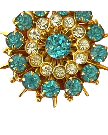 - Vintage blue clear crystal gold starburst brooch