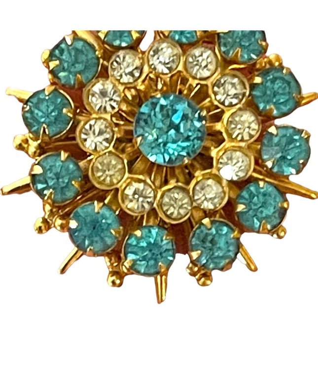 - Vintage blue clear crystal gold starburst brooch