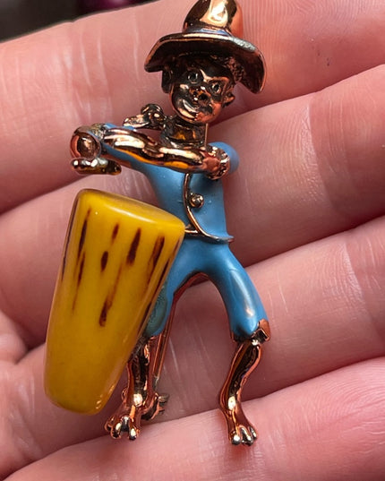 Vintage Bakelite drummer copper finish enameld brooch Charles Worth book piece