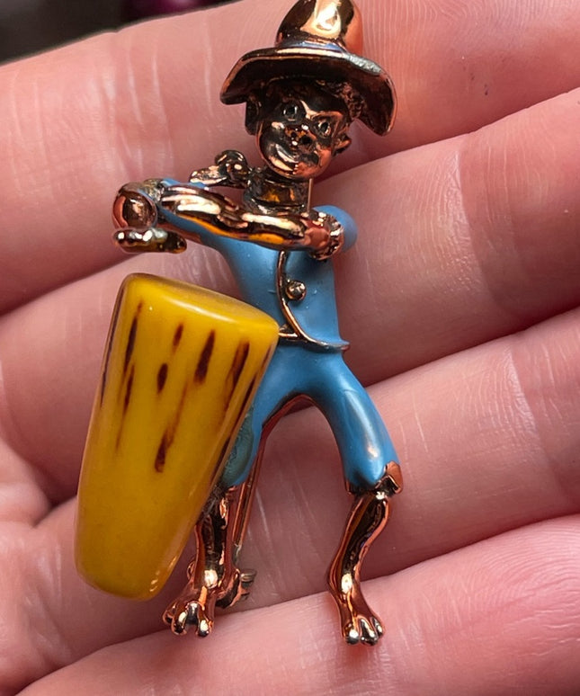 Vintage Bakelite drummer copper finish enameld brooch Charles Worth book piece